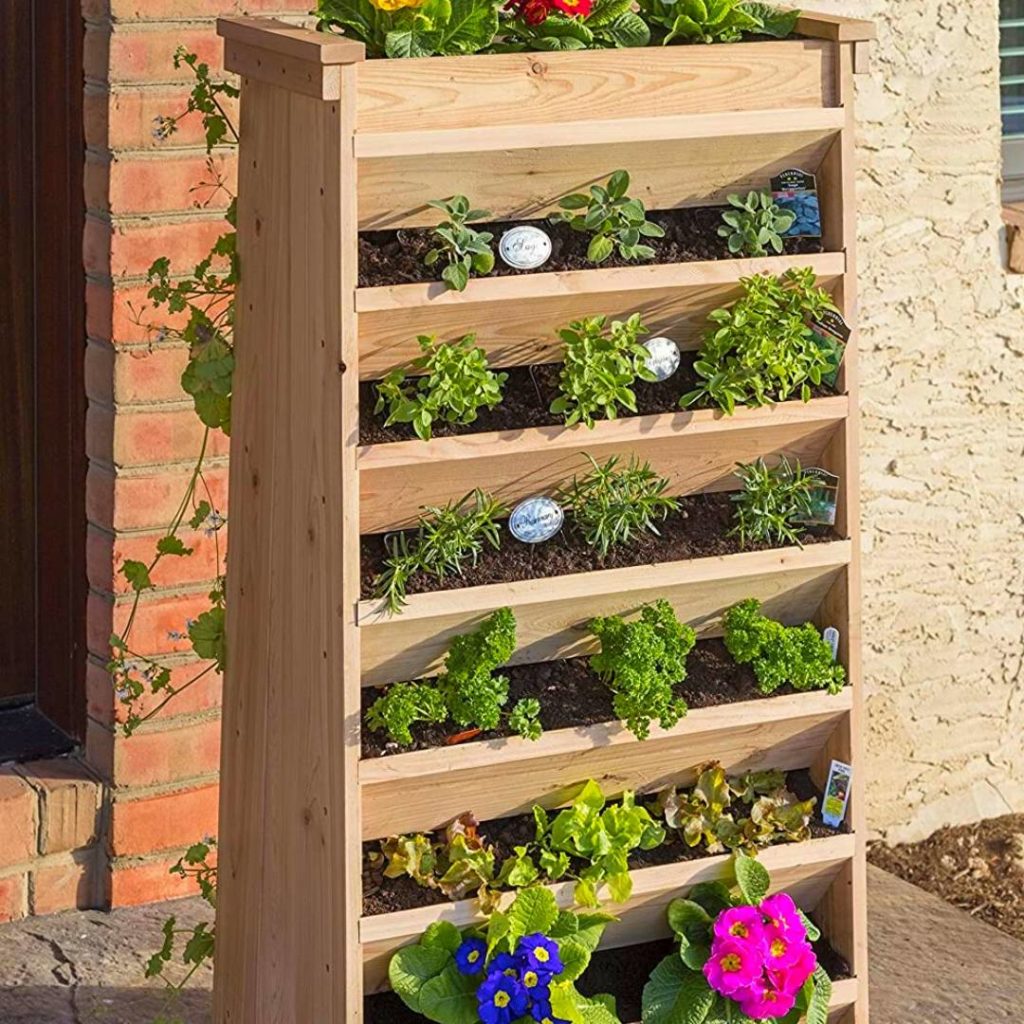 Small vertical garden for herbs with various pots and plants